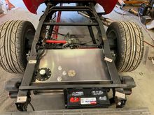 Best weight transfer will be with the battery behind the right rear tire. 
Doing all I can to help traction.
** If I find I can't get it done with leafs, I will change to coil-overs, (in a heart beat)!