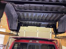 Bed back UP!
Wire brushed, acid treated, undercoated
When I work out the fuel-fill door and hose to cell and make up the battery cables, then the bed can come down to stay. ... YEA !!  👍