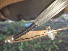 OEM Equalizer with missing retaining tab for driver side cable