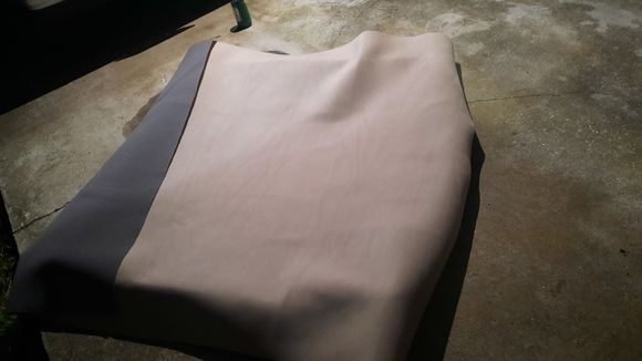 An hour or so with a roller and some contact cement spray got it laid out pretty well.  