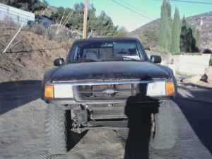 no bumper or tailgate, bald tires