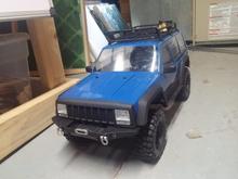 SCX-10 2 fresh blue paint backed in black with matte black front clip, fenders, side skirts and roof lines.