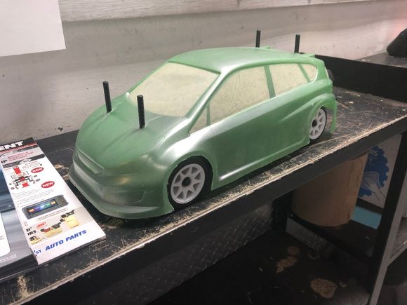 The MG FWD. still have to put the wing on. But you can see how the rear posts are directly in front of the wing. And they didn’t include anything to raise wing height. 

Yes body posts will be cut. 