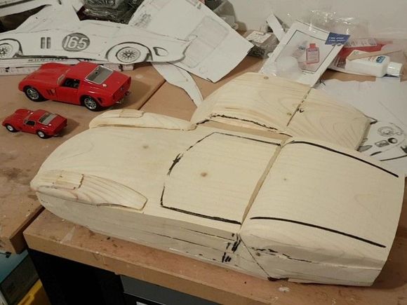 The (very rough) mold. The mold is made out of 3 pieces (front, rear & roof). 
The parts will be screwed together later and can be detached to take them out of the body after vacuum-forming.