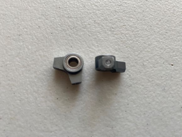 These are use set of aluminum locker arms, note broken ball stud in unit on right