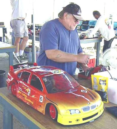 Me standing next to my 1:5th scale BMW Super Touring Car at the 2004 ROAR Region 12 1:5 Scale Championships.