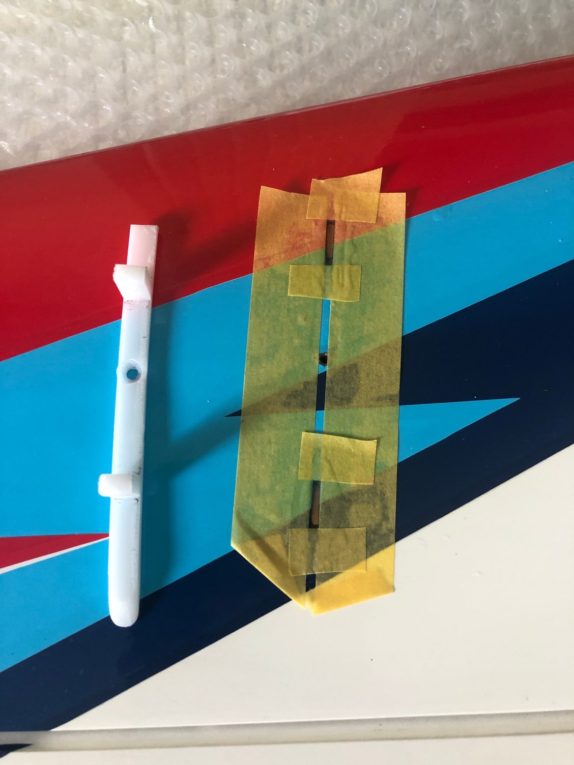 Original slots are filled with a 2 mm plywood piece epoxied in place