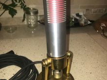 A totally home made, ribbon type microphone.  The internal element uses a .0002" thick 1/4" wide by 1" long corrugated aluminum ribbon tensioned between two neodymium magnets that generate a current when moved by sound. I use this one at my ham radio station regularly.   
    Lathe and mill used. Total cost of the lathe and mill was less than a Saito 182!  