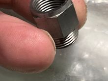 12mm female on the other.

Adds one muffler thread length to the pipe.