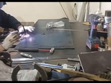 A bolt is first welded by temporary welding