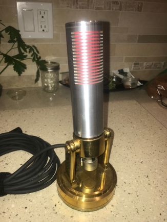 A totally home made, ribbon type microphone.  The internal element uses a .0002" thick 1/4" wide by 1" long corrugated aluminum ribbon tensioned between two neodymium magnets that generate a current when moved by sound. I use this one at my ham radio station regularly.   
    Lathe and mill used. Total cost of the lathe and mill was less than a Saito 182!  