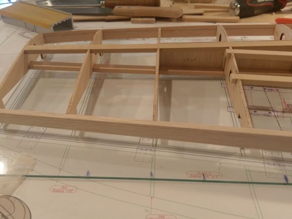 While the ribs have tabs, one steam bend in the main spars allowed them to be fitted without pressure.