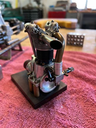 My first engine.  Made from rough castings (cylinder head, crank case and cam cover). Every thing else I made from scratch.  I take that back.  The carb came off an OS I think.