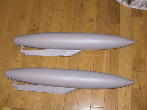 The tanks/pylons come pre installed and drilled. Nice detail could benefit from the scale markings they normally have.