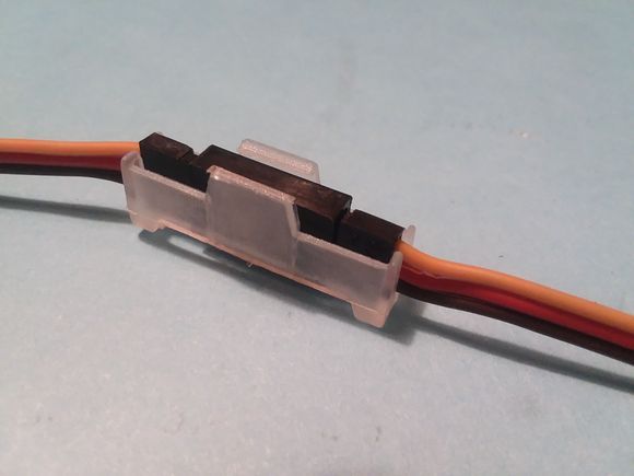 Just slide it in and hear the clip grab the top of your servo plugs to keep them together!
