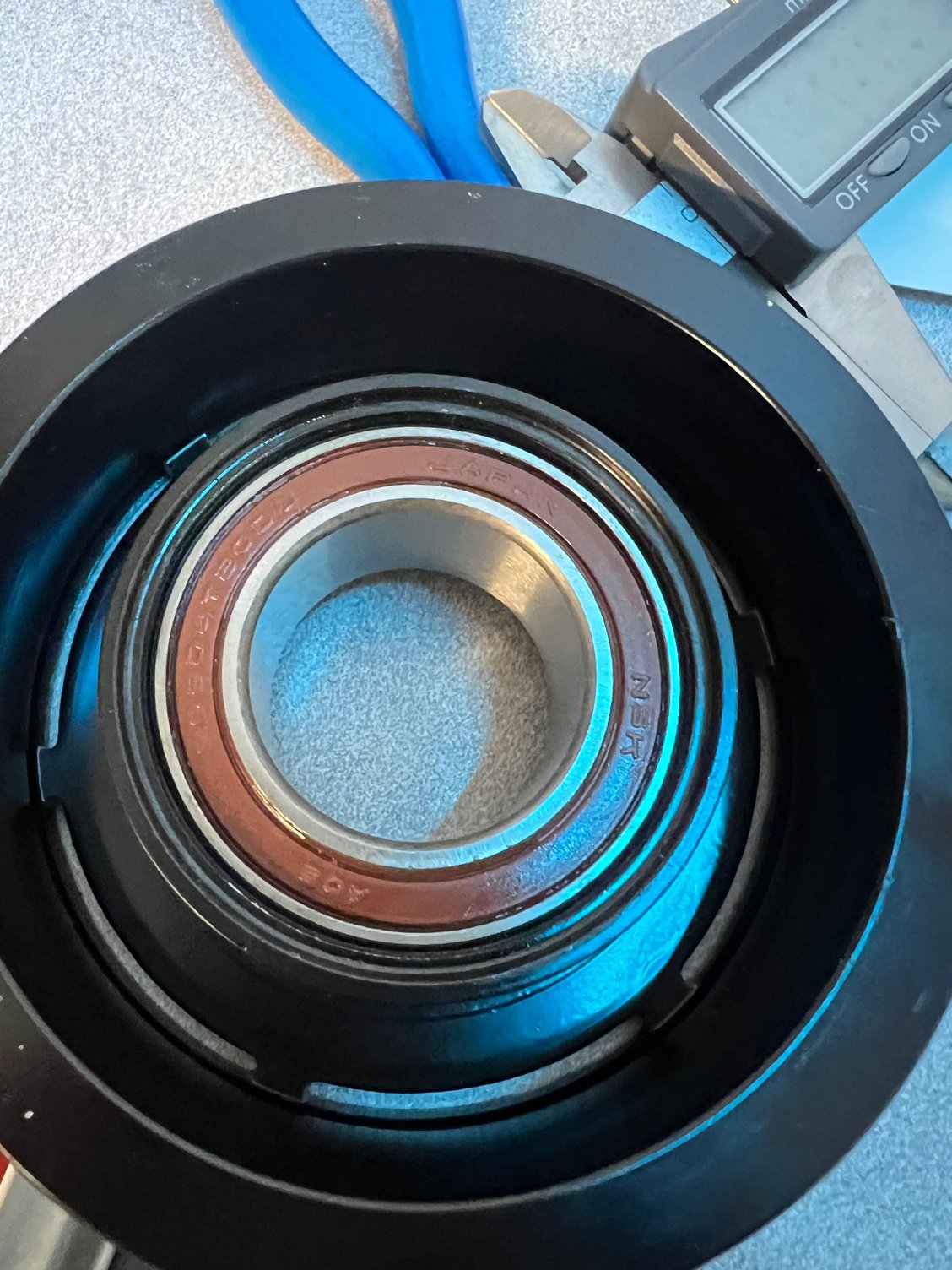 Chinese pulley, replaced its original Chinese bearing with an NSK bearing made in Japan. I chose not to punch around the pulley to allow for easier bearing replacement in the future. The fit is tight, and I believe the bearing won’t shift in the bore. If you are doing the same thing, it’s up to you to decide to center punch around. 