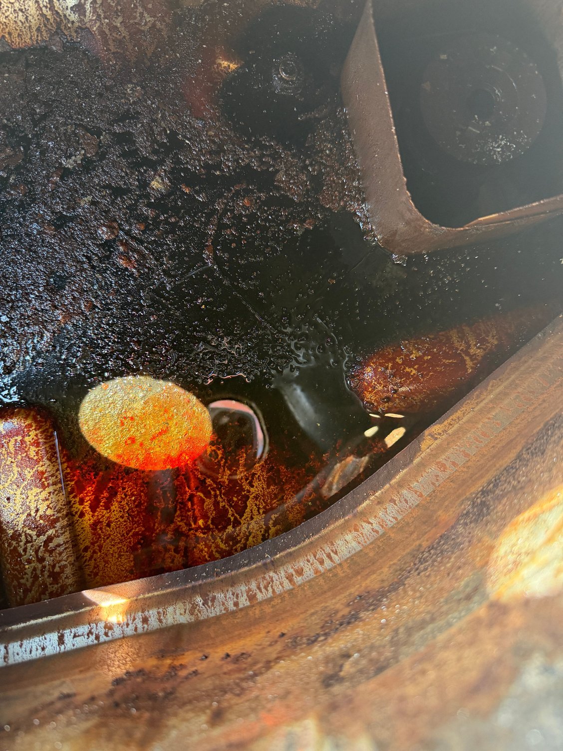 Inside of the tank before getting after it with the pressure washer.