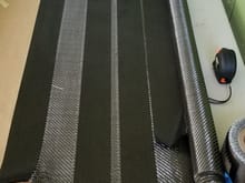 I started with carbon tape followed with 2 layers of 2x2 carbon fiber twill 
