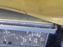 This is the other side - radiator doesn't hang on the bumper on this side, but since it does on the other, you can see the big gap between the radiator & bracket that is supposed to be supporting it