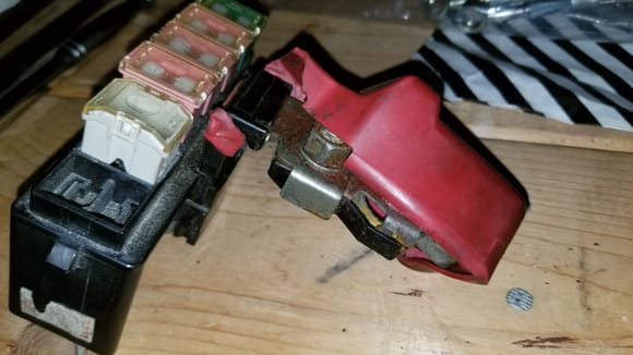 Fuse block removed from car.