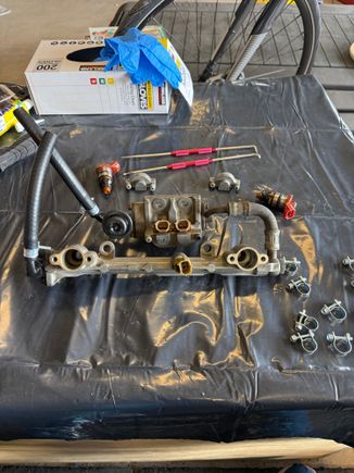 Here is how it looks assembled. I did replace the orings in the lower intake where the primary and secondary injectors mate in their respective places. 
I assume something is not right. Is fuel getting past an oring and just flooding the lower intake?  Or when you jump the fuel pump, does the car also inject fuel as well?  It is a lot of fuel. 