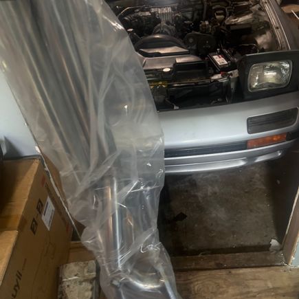 Guess what came in the mail!!??! A new downpipe and hopefully something to take the flames farther from my engine bay this time hah
