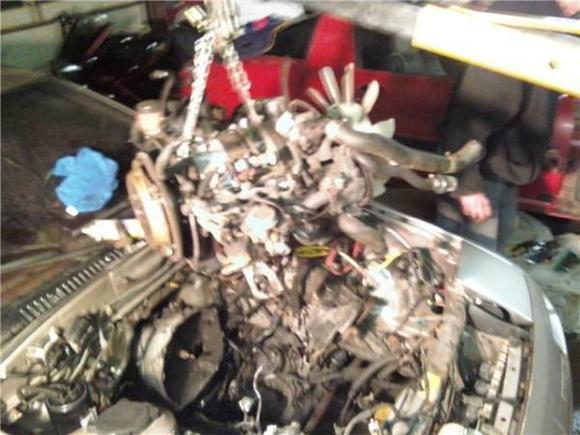 thats wen we got the motor out. and thats my dads red 85 rx7 all stock