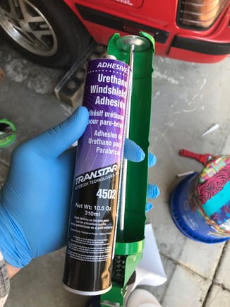 The adhesive I used to replace the window.  This stuff is THICK!  I put the tube on the dash of my truck in the sun and rotated it once in a while as I was doing other work.  It was in the 60's at the  time.