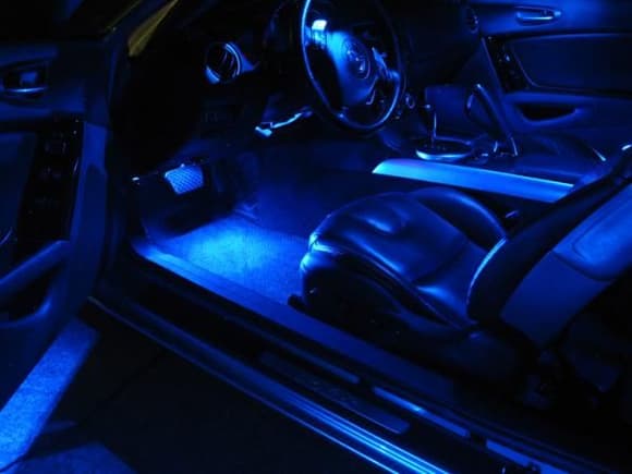 Wired in custom blue LED footwell lights to light the driver and passenger footwells. (3/14/10)