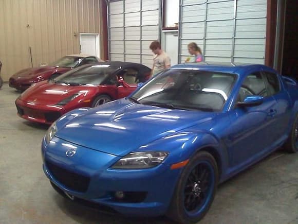 i might not roll deep but i sure as hell roll fast...back to front: supercharged convertible corvette, lamborghini gallardo spyder, and mazda RX-8. i love toys.
