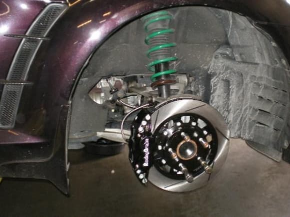 Tein S-tech springs and Racing Brake BBK 4-piston calipers with slotted rotors.