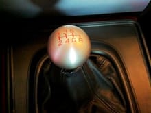 Latest edition to my collection of shift knobs: Type R 6 speed Honda knob. This one is my favorite just because it looks cool. Doesn't feel as nice as the Moddiction knob, but the cool factor is worth something. Love, love, love the red lettering that matches my red interior.