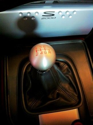 Latest edition to my collection of shift knobs: Type R 6 speed Honda knob. This one is my favorite just because it looks cool. Doesn't feel as nice as the Moddiction knob, but the cool factor is worth something. Love, love, love the red lettering that matches my red interior.