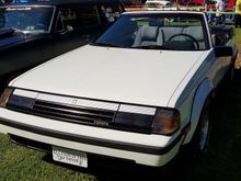 The tag reads "My husband has a blown 67 Camaro & a 68 Tube Chassis Barracuda   ALL I GOT IS THIS ?*&# TOYOTA! 