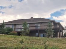 Closer view of house back which looks to the west.