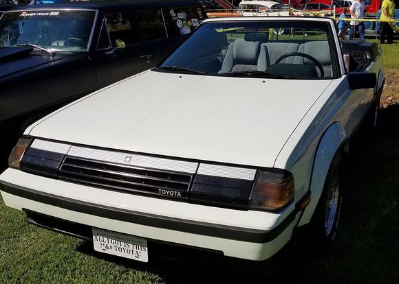 The tag reads "My husband has a blown 67 Camaro & a 68 Tube Chassis Barracuda   ALL I GOT IS THIS ?*&# TOYOTA! 