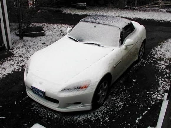 Snow covered White S2000 from front elevated