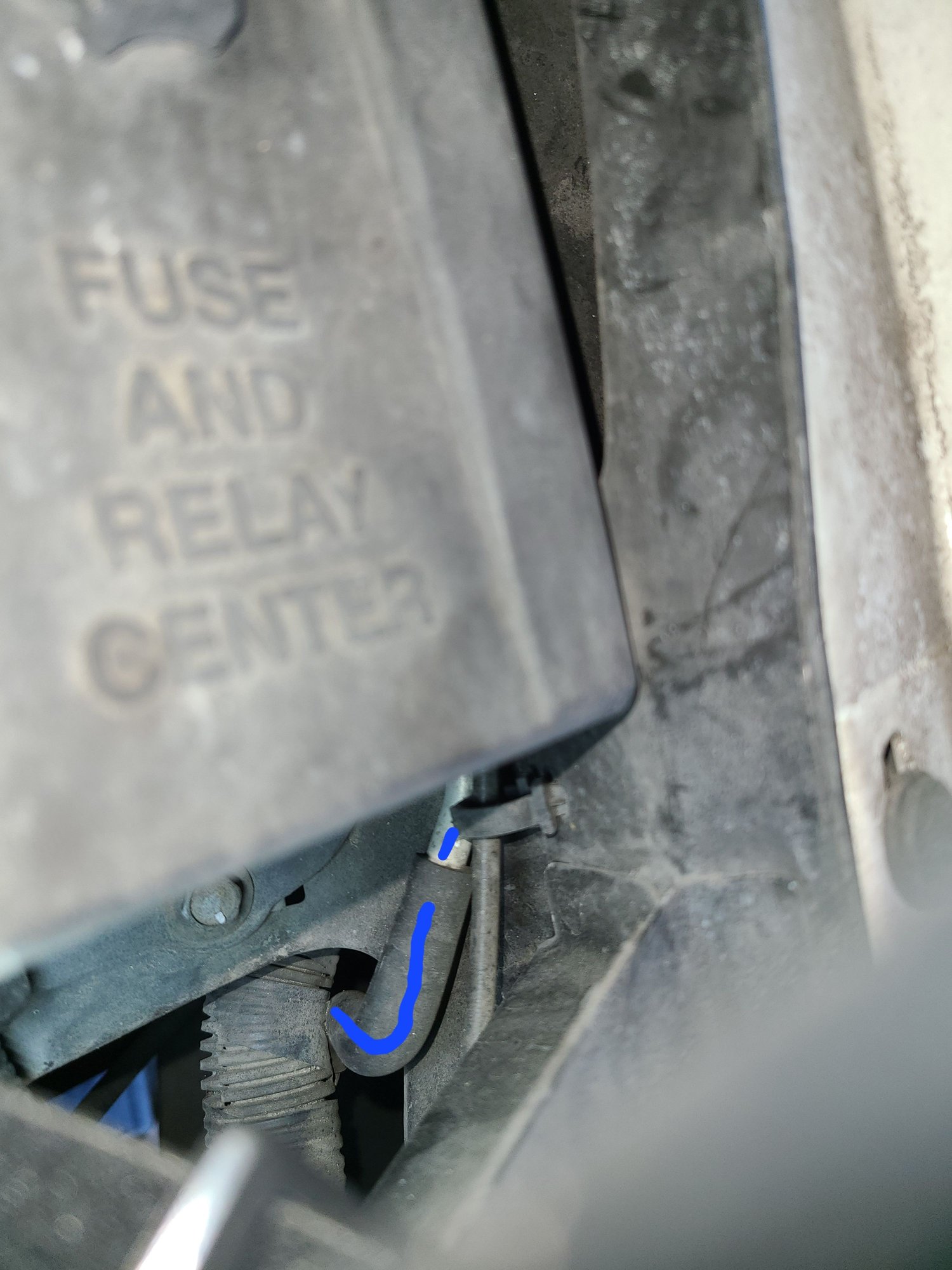 The liquid line routes upward from the receiver drier, and to the right of the fuse box.