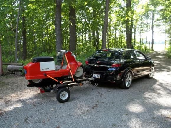 2008 Astra XR 3 door. 5 speed ,leather, premium sound, 18&quot; wheels, plus I installed a &quot;boomerang&quot; armrest. 17,600 miles. Shown towing my 1964 H-D Topper AH motor scooter. Yes... Harley did make (a big) scooter for a few years.