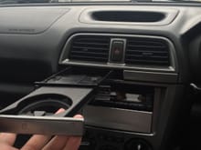 Now pull your cup holder straight out to remove it.