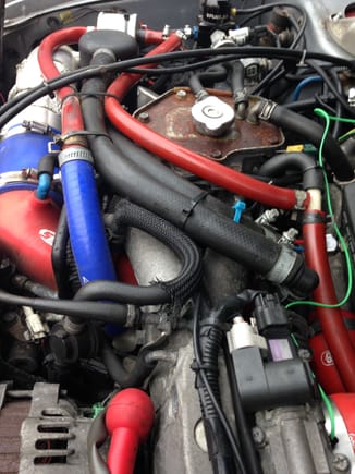 to the right the red pipes T from the head breathers and run to the small inline head filter CC
the 2 large black pipes, one connected to the crankcase breather which runs to the catch can, the 2nd runs back to the turbo intake pipe.
