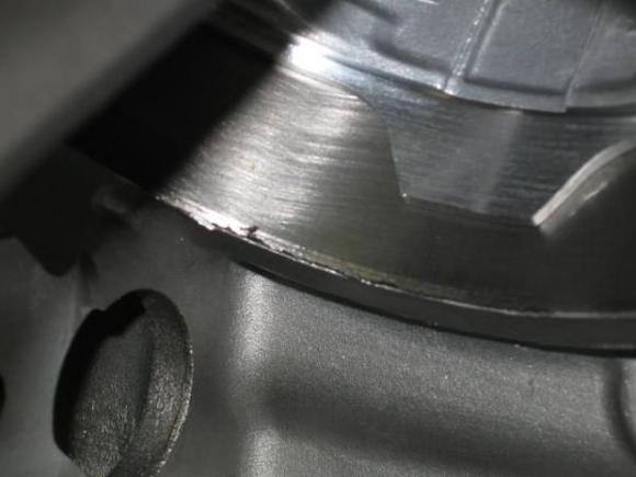 THIS BLEMISH IS RIGHT AT THE BOTTOM OF ONE OF THE CYLINDERS .