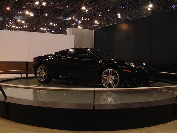 F430, black, ball-polished wheels, red calipers, carbon ceramic brakes.