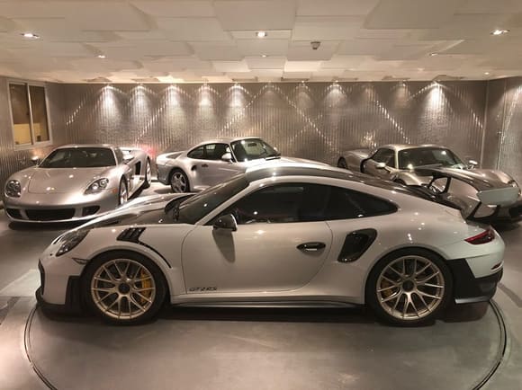 Quite a sight to see! This is what supercar heaven looks like. Here, we have a brand new Porsche 911 GT2 RS. Along with the Porsche Carrera GT, 959, and 918 Spyder Weissach. Guess what? It's all owned by one guy! He has great taste in cars. Congratulations to him.