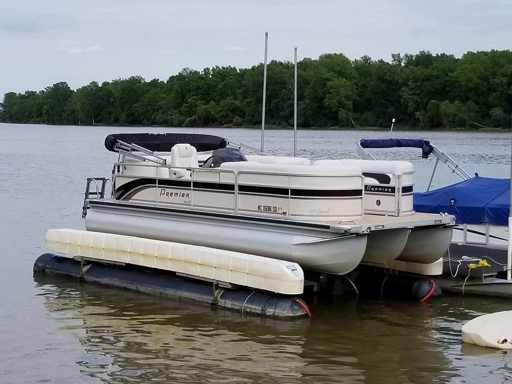 How far can pontoon tubes extend past the bunks on a boat lift? The