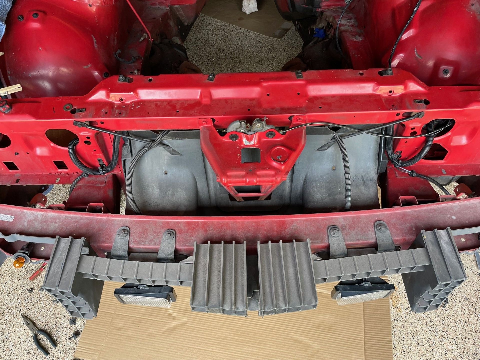 Does your car have that black plastic piece that is right in front of the radiator in this picture?  That plastic piece is routing the air where it needs to go for proper cooling.  You gotta have it in place.