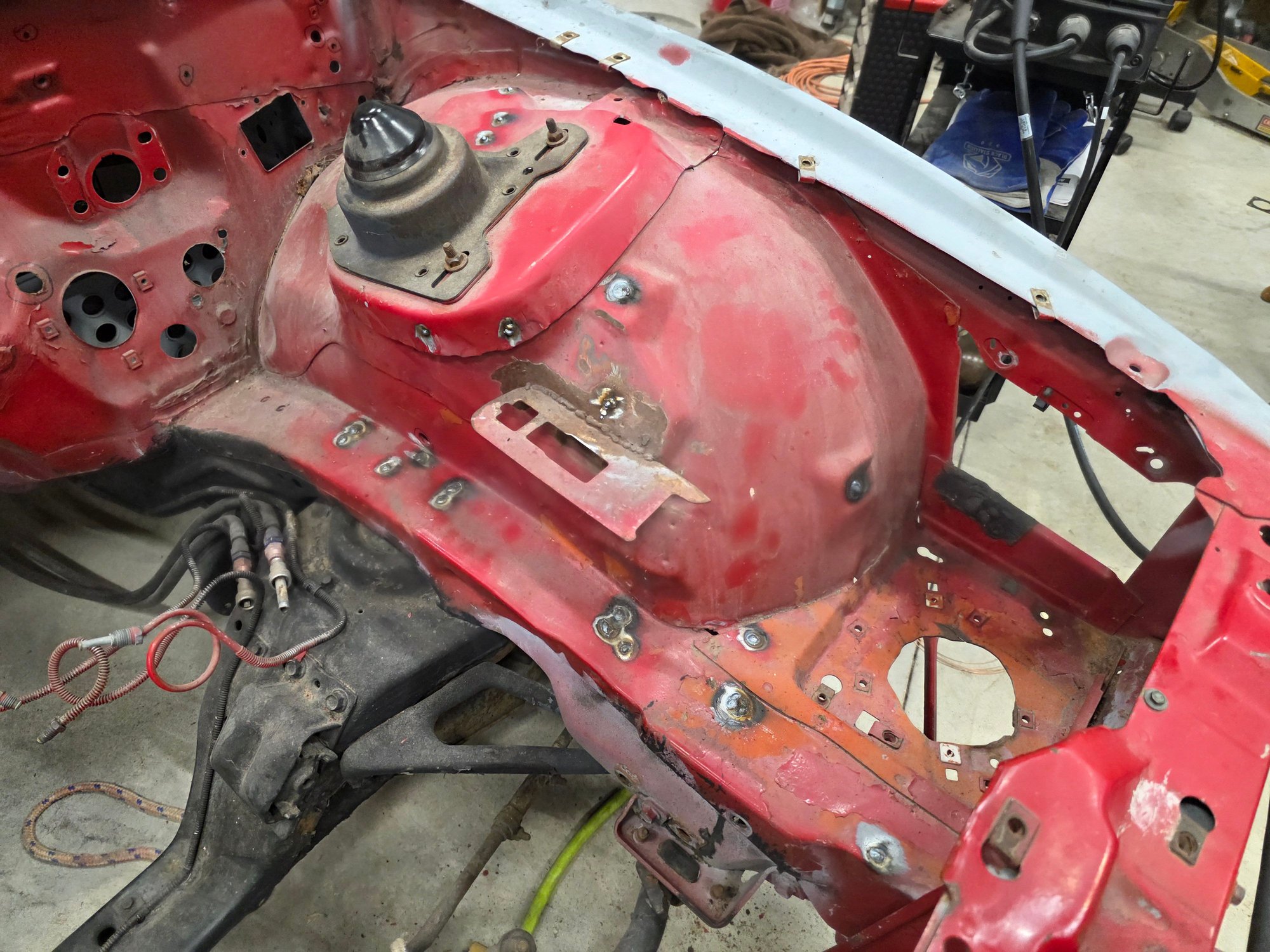 Welded up all the holes on the driver side strut tower/rail.