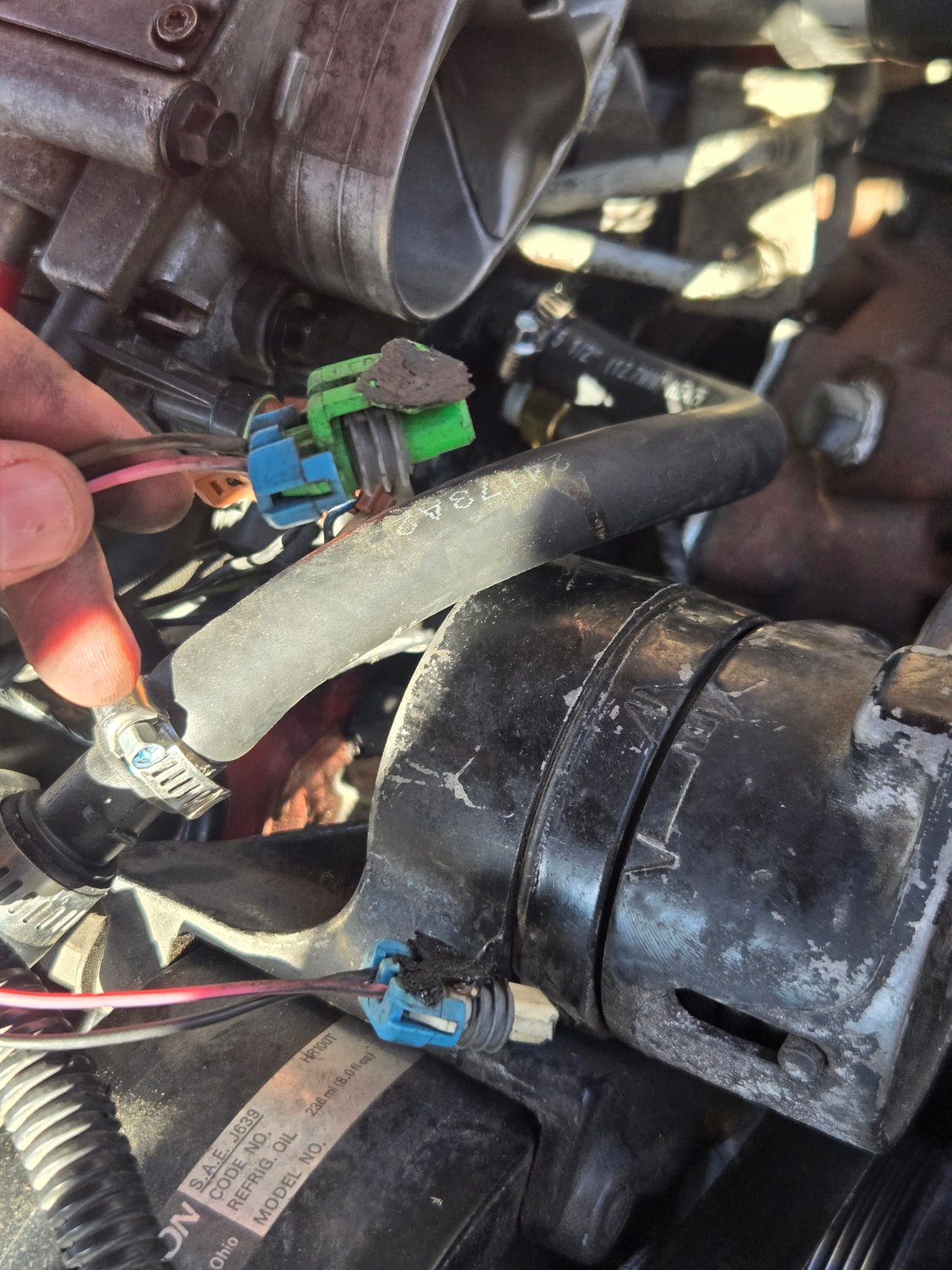 I have these 2 wires that have just been hanging here for years, the car has been sitting for a long time and it runs super rich, im wondering if these have anything to do with the issues i am havung with the car, can any one here identify these? Thank you