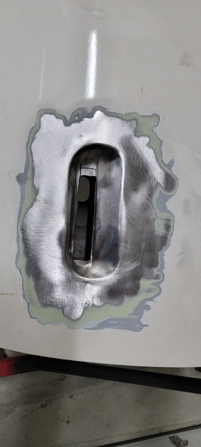 Cut out the base of the handle depression so I can paint the backside with rust encapsulator after the welding is complete.