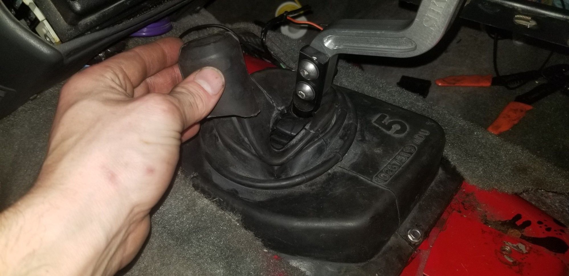 Had to cut the neck off of the 4thgen 5 speed boot for the arm to fit.  Bit of a hole, but better than nothing!